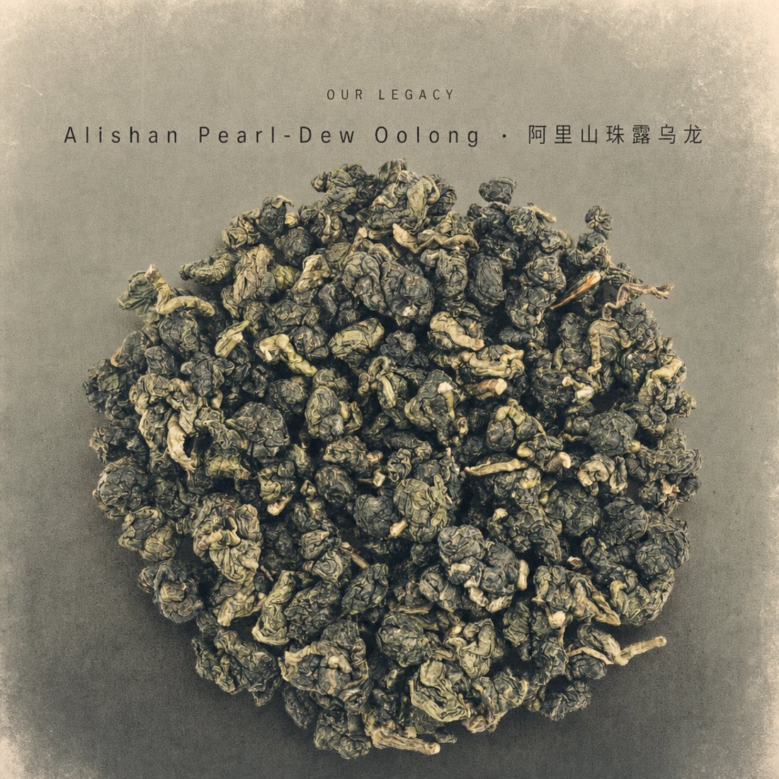 A circle of silver-white Yunnan buds on plain white with a widely letterspaced caption in light caps underneath